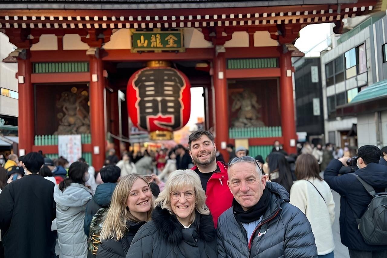 Travelers at the Kaminarimon gate of Senso-ji, with the giant red lantern